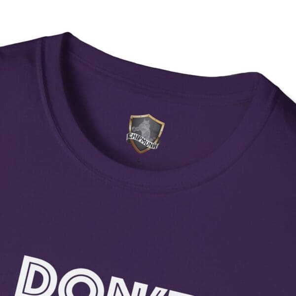 Purple "Don't Be A..." Tee featuring a logo with a shield and chipmunk image near the collar, with partial text below.