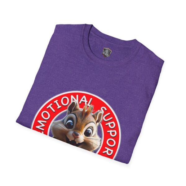 A folded T-shirt in purple with a cartoon chipmunk and the phrase "Emotional Support" displayed on a red and white circular background.