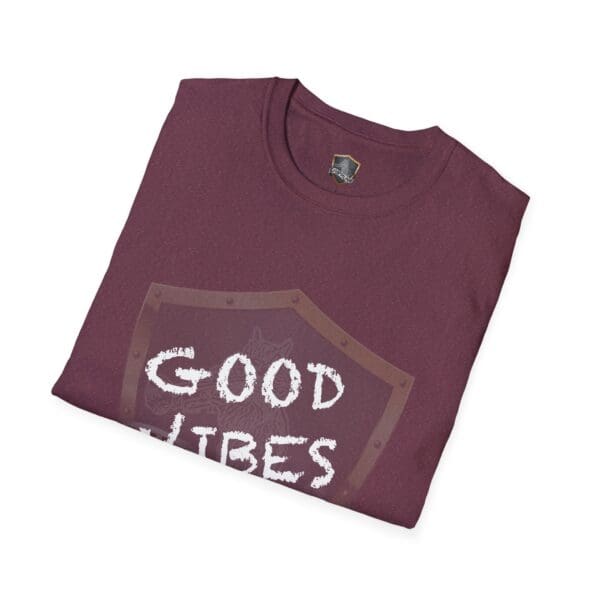 Folded Good Vibes Only Shirt in maroon, showcasing a graphic design with large white letters partially visible.