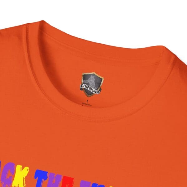 Close-up of an orange "Colorful Angry Unicorn Tee" with a vibrant slogan partially visible. A "Chipmunk" branded label is seen in the neck area.