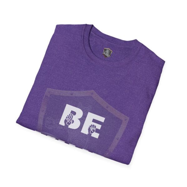 On a plain white background, the t-shirt is purple and features white text "BE" next to two hand symbols, representing the Be Kind in Sign Language T-Shirt.