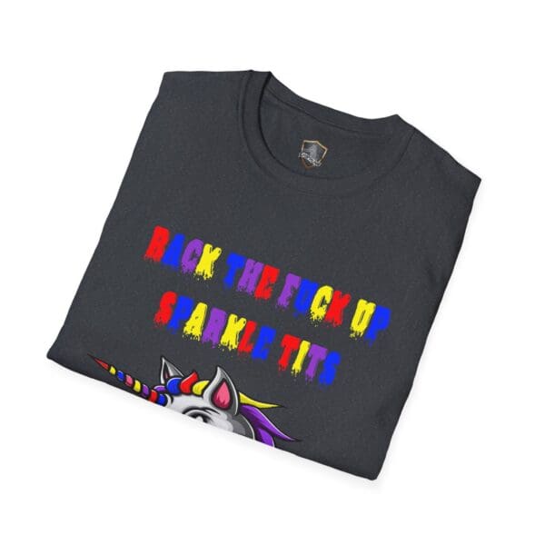 A folded black Colorful Angry Unicorn Tee featuring vibrant text "RACK THE FUCK UP SPARKLE TITS" and a unicorn illustration at the bottom.