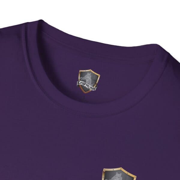 Close-up of a purple "F Cancer Childhood Cancer Awareness T-Shirt" featuring a small shield logo labeled "CHIPMUNK" below the collar and an additional shield logo design on the front.