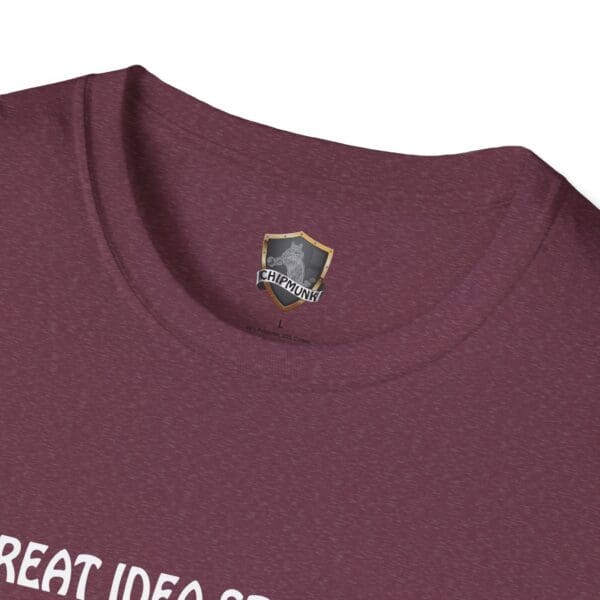 Close-up of a maroon Great Idea T-Shirt with a "Chipmunk L" label inside the collar and partial white text reading "REAT IDEA" on the front.