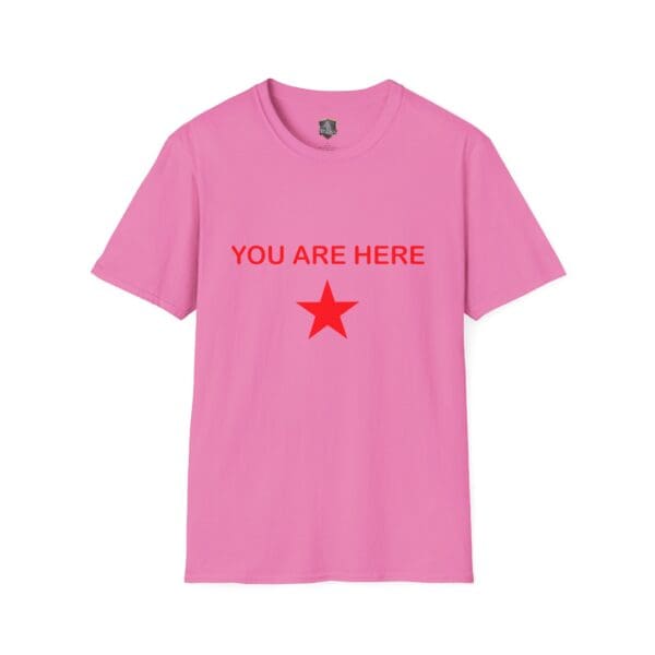 The Guiding Star Tee Shirt is pink and features red text that says "YOU ARE HERE," accompanied by a red star below the text.