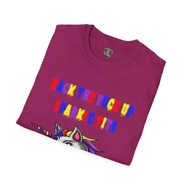 A folded Colorful Angry Unicorn Tee featuring a maroon color and a vibrant text design saying "Back the f- up sparkle tits" above part of a unicorn image.