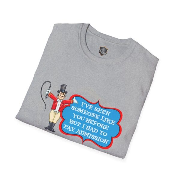 Gray folded Admission T-Shirt highlighting a cartoon ringmaster with a whip and the text: "I've seen someone like you before but I had to pay admission.