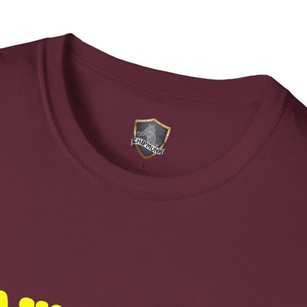 Close-up of a maroon Awesome Shirt collar with a yellow graphic partially visible at the bottom.