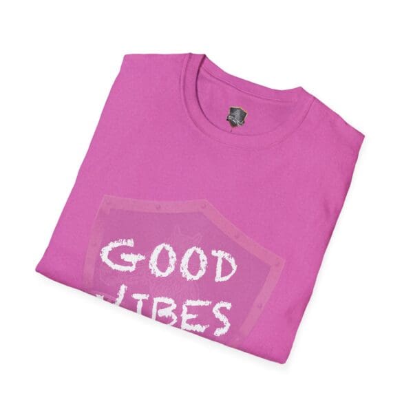 Folded pink "Good Vibes Only" t-shirt with a white print on the front.