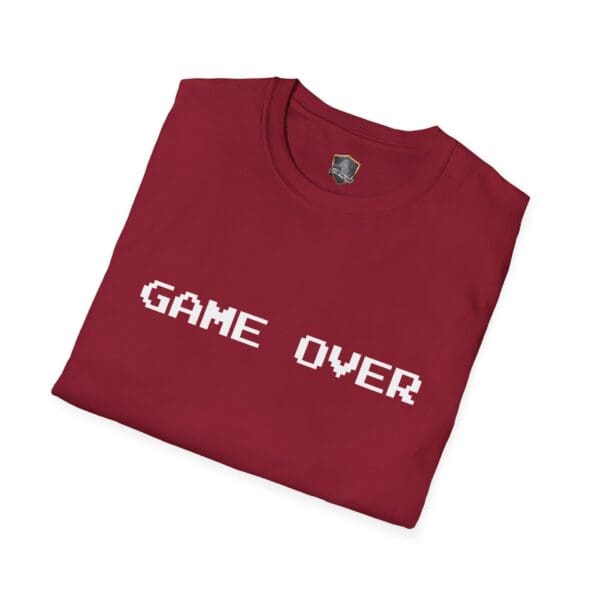 A folded maroon Game Over T-Shirt featuring "GAME OVER" printed in white pixelated letters on the front.