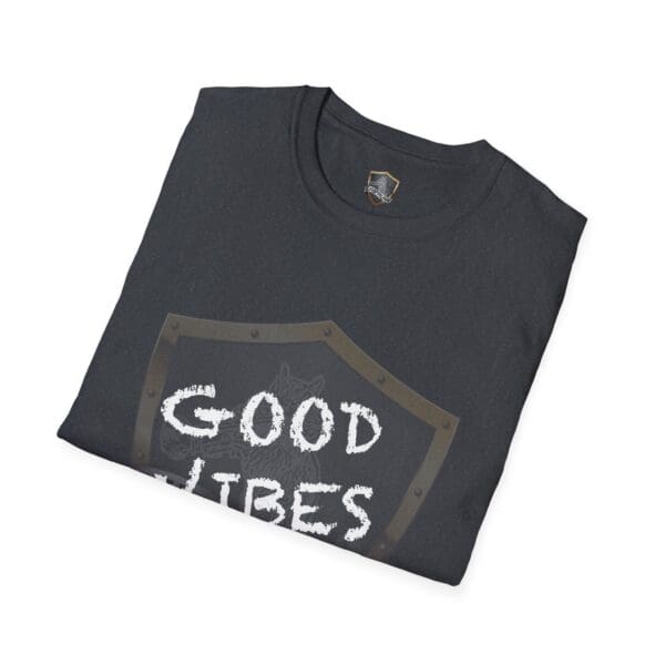 Folded dark gray T-shirt labeled "Good Vibes Only Shirt" with a small badge design near the collar.