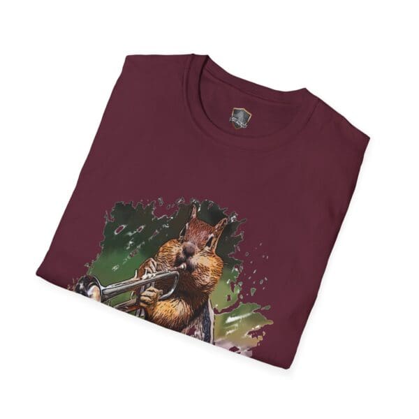 OG Chipmunk T-Shirt: A maroon t-shirt featuring an illustrated chipmunk playing a trumpet, set against a vibrant background with splashes of green and purple.