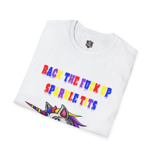 A neatly folded Colorful Angry Unicorn Tee featuring vibrant text, "BACK THE F**K UP SPARKLE TITS," alongside a unicorn graphic on a white background.