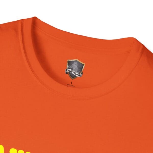 Close-up of an orange Awesome Shirt with a "CHIPMUNK" label inside the collar and a yellow graphic partially visible at the bottom.