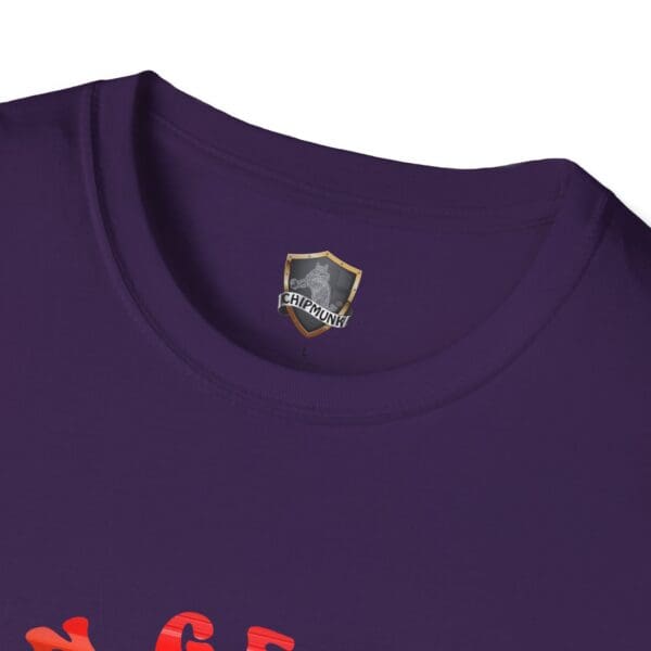 Close-up of a purple "C'mon George!! Retro Rainbow Roadie T-Shirt" with red lettering partly visible near the bottom.