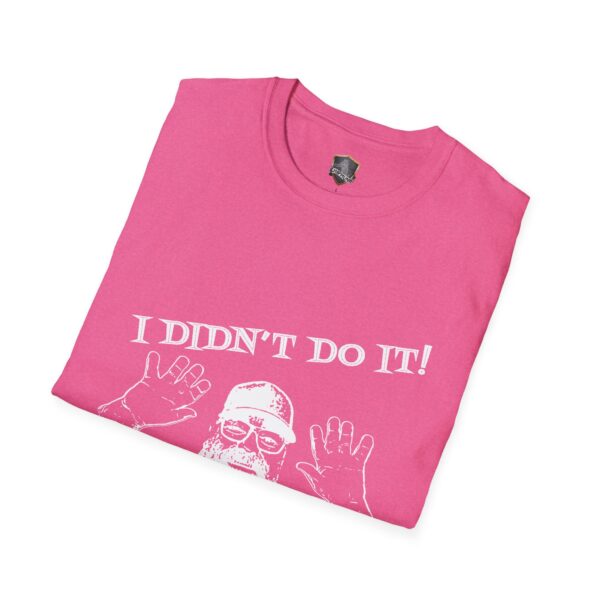 Pink folded T-shirt featuring a white graphic of a person with raised hands and the text "I Didn't Do It! I Was Framed!!!" from George the Roadie's Iconic Icebreaker T-Shirt collection.