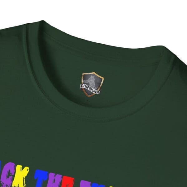 Close-up of a dark green Colorful Angry Unicorn Tee, showcasing the Chipmunk brand label on the inside collar and partially visible colorful text at the bottom.