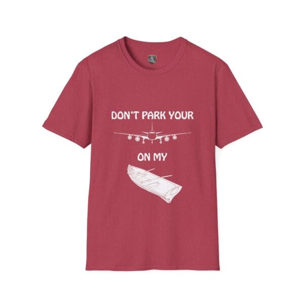 Red "Don't Park Your Plane On My Dingy" t-shirt featuring white print above an airplane graphic and a canoe graphic.