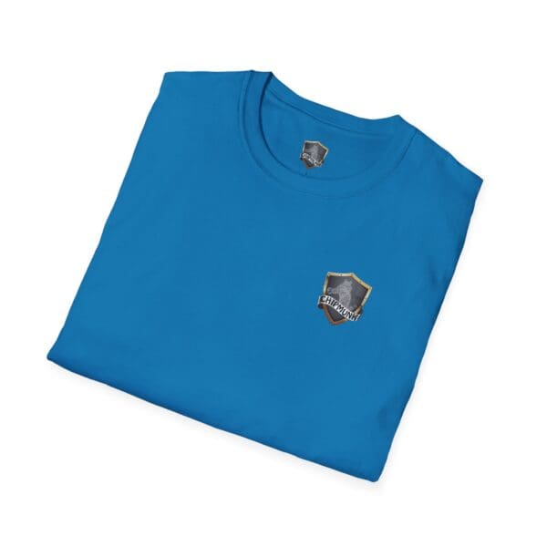 Folded blue t-shirt featuring a small badge with a shield emblem and the word "ENIGMAITH" on the front, identified as the F*ck Cancer Ribbon T-Shirt.