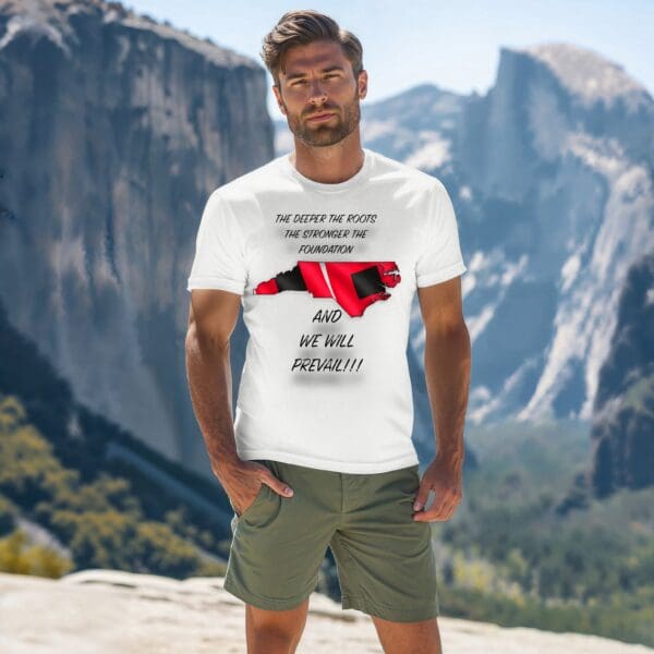 A man stands outdoors with a mountainous backdrop, wearing the "Stronger Together: Hurricane Helene Relief Tee," featuring text and a red graphic on a white T-shirt.