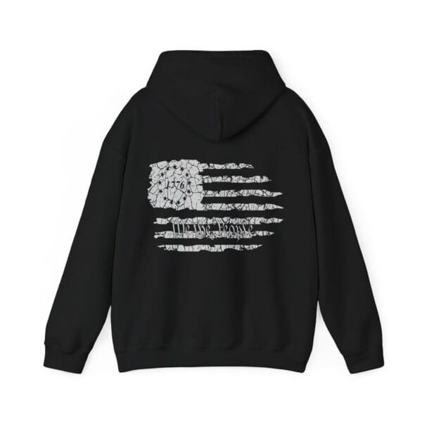 American Pride Hoodie in black, showcasing a distressed American flag design on the back with the year 1776 and the words "We the People.