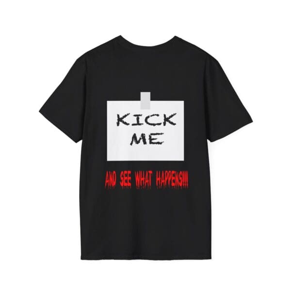 Kick Me T-Shirt in black, featuring a taped note illustration on the back with bold "KICK ME" text and red, stylized font below that reads "AND SEE WHAT HAPPENS!!!".