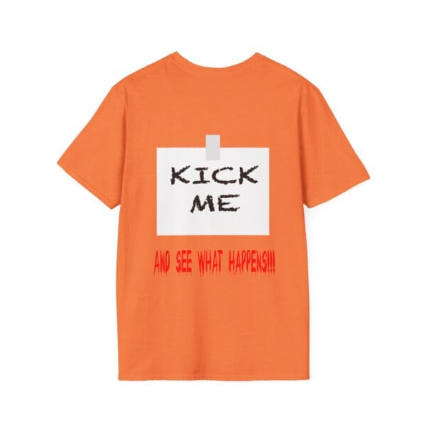 The Kick Me T-Shirt is orange and features a taped paper design with "KICK ME" in black text and "AND SEE WHAT HAPPENS!!!" in red text below it.