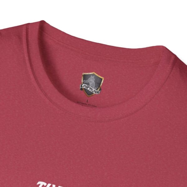 Close-up of a red T-shirt called "The Man T-Shirt," featuring a Chipmunk logo on the inside neck label.