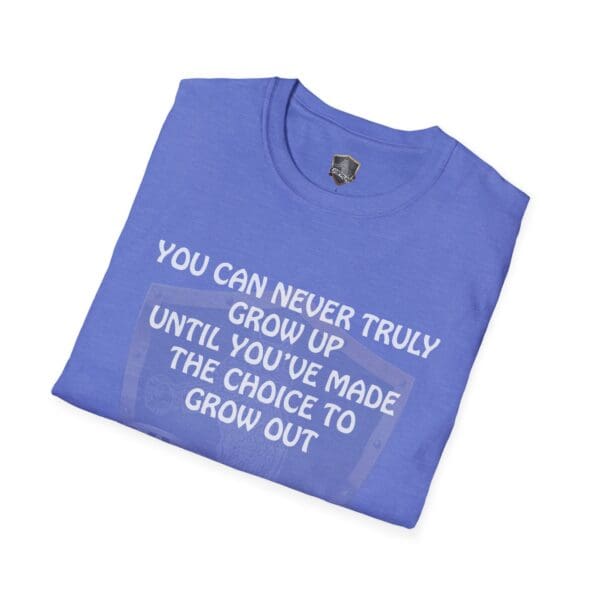 Folded 'You Can Never Truly Grow Up T-Shirt' in blue, featuring the printed message: "You can never truly grow up until you've made the choice to grow out" on the front.