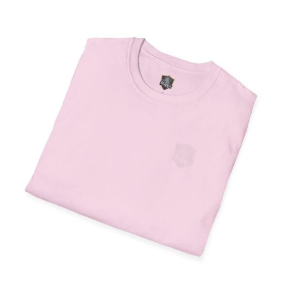 A folded You Bought It Because We Brought It T-Shirt in light pink with a small shield logo near the neckline.