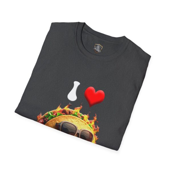 The I Love Hot Taco T-Shirt is shown folded, featuring a graphic of a stylized pitcher, red heart, and taco adorned with sunglasses and flames.