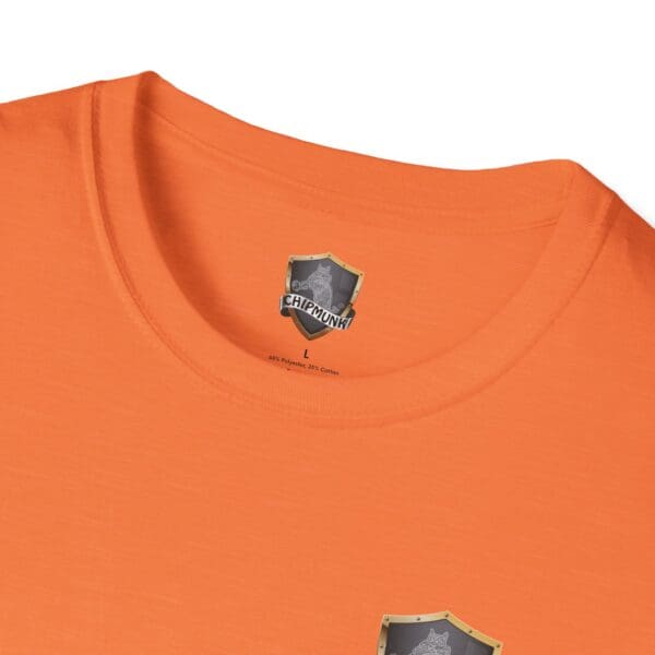 Kick Me T-Shirt in orange featuring the "Chipmunk" logo on the inner collar and a small printed emblem near the chest.