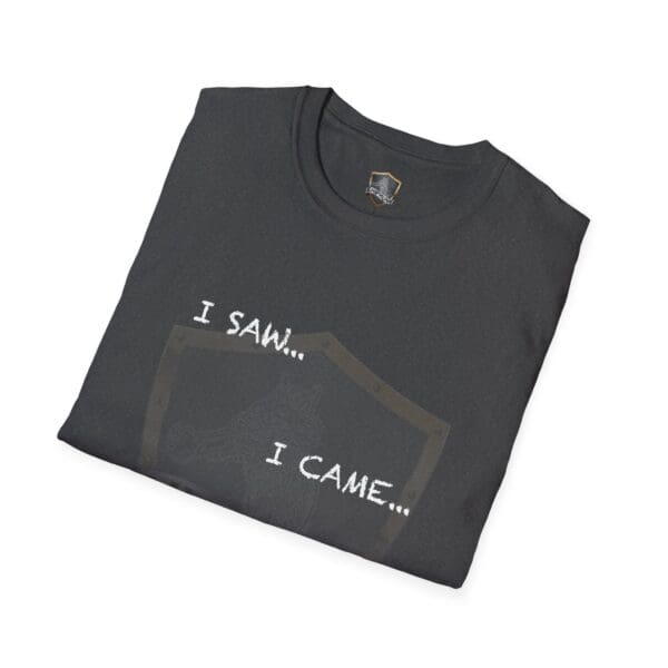 A folded black "I Saw T-Shirt" featuring the text "I SAW... I CAME..." printed on it.