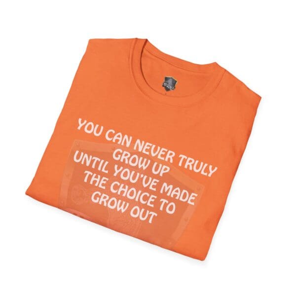 You Can Never Truly Grow Up T-Shirt in orange featuring the text: 'You can never truly grow up until you’ve made the choice to grow out.'