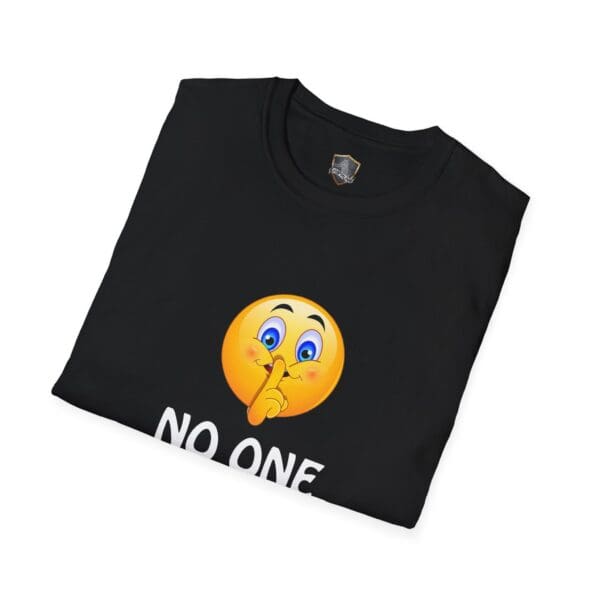 Black "No One Cares" t-shirt, featuring a shushing emoji above the text "NO ONE," folded neatly.