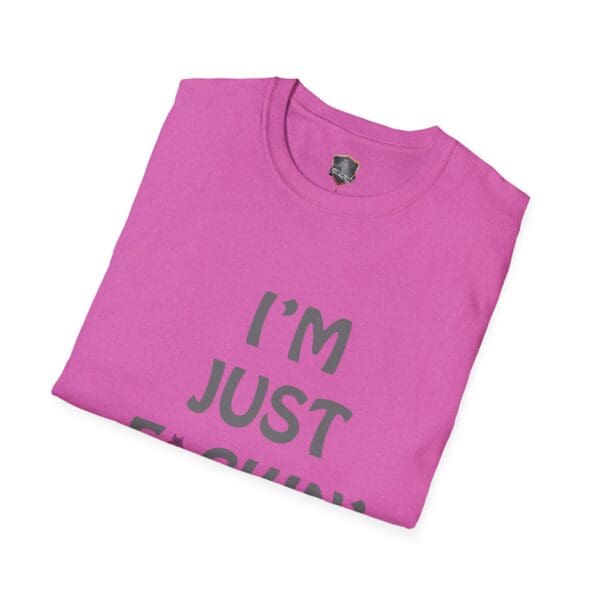 Folded pink t-shirt with bold text saying "I'M JUST F*CKIN", known as the I'm Nuts T-Shirt.