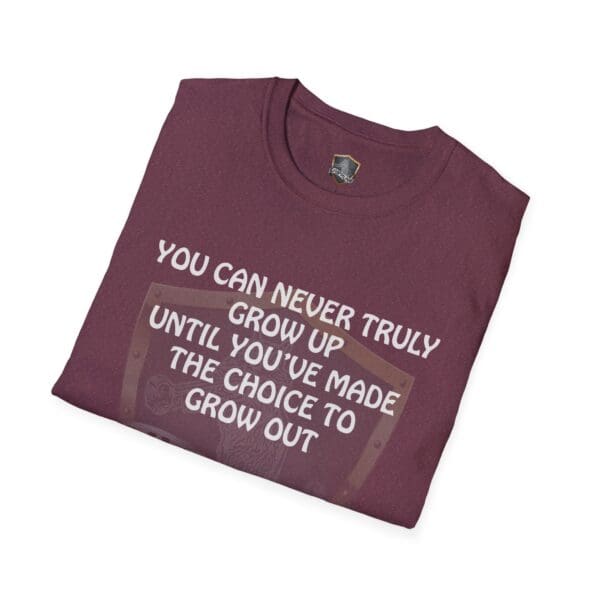 Folded 'You Can Never Truly Grow Up T-Shirt' in maroon featuring a white text design that reads, "You can never truly grow up until you've made the choice to grow out.