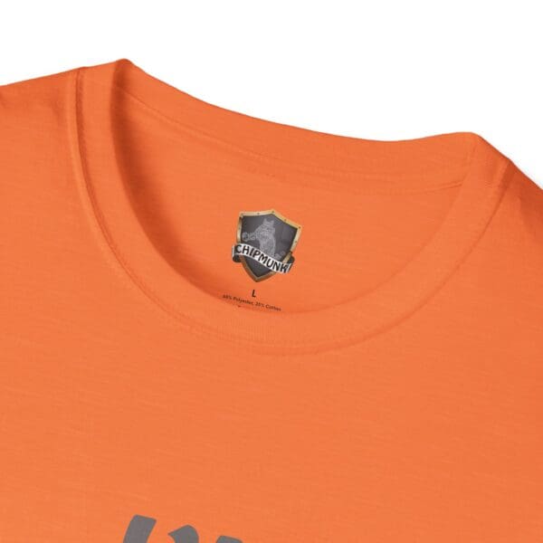 Close-up of an orange collar with the "I'm Nuts" T-shirt logo and size label printed inside.