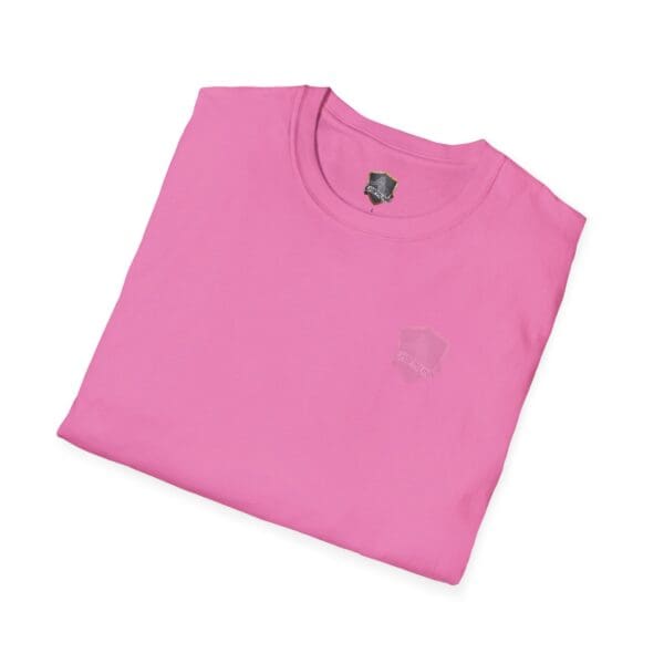 A folded "You Bought It Because We Brought It" T-shirt in pink, featuring a subtle logo on the chest.