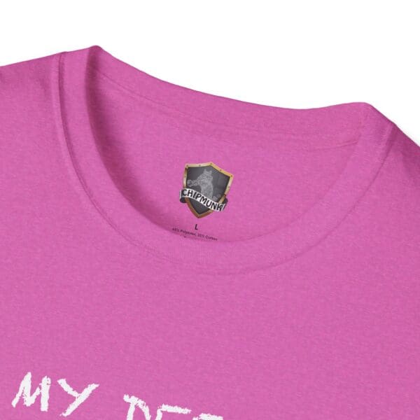 Close-up of the Unsupervised Mischief T-Shirt, featuring a small chest logo and partially visible text in pink.