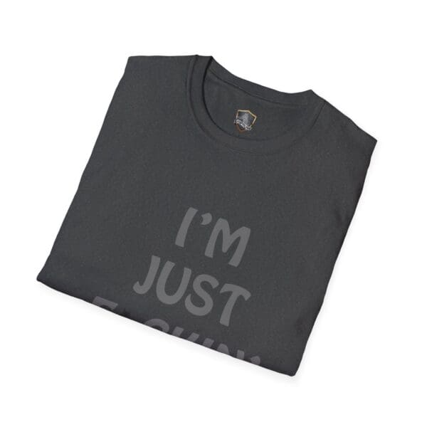 A folded "I'm Nuts" T-shirt in black with partially visible text.