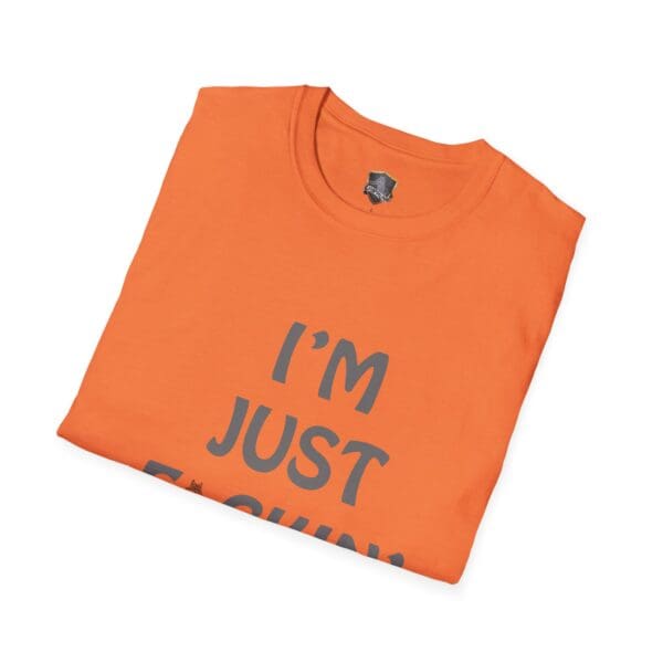 Folded orange "I'm Nuts" t-shirt with partial text showing "I'M JUST F...".