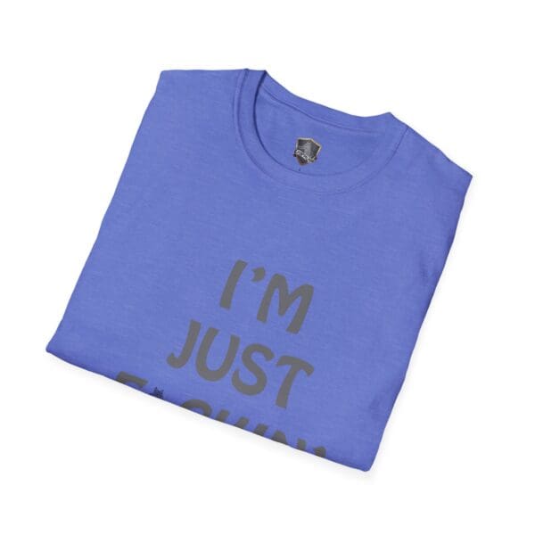 A blue t-shirt with the text "I'M NUTS" partially visible in dark print, folded neatly.