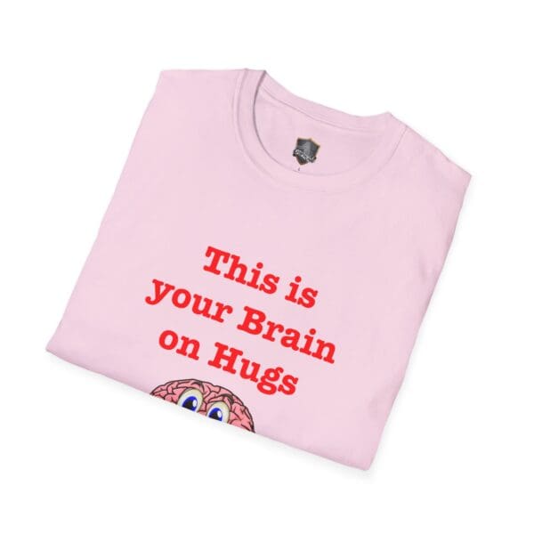 This is 'Your Brain on Hugs' t-shirt in pink, featuring a cartoon brain graphic and the text "This is your Brain on Hugs.