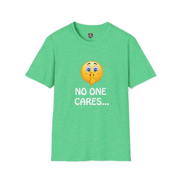 A green "No One Cares T-Shirt" features a yellow emoji making a shushing gesture and white text reading "NO ONE CARES…" on the front.