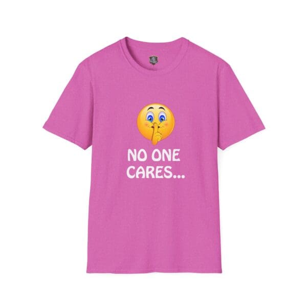 Pink "No One Cares T-Shirt" featuring a shushing emoji and the phrase printed on the front.