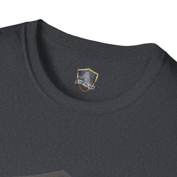 Close-up of the collar of a dark gray T-shirt with a shield-shaped label displaying a chipmunk logo and the text "Chipmunk" on the "Your Story Is Not Mine to Tell" T-Shirt.