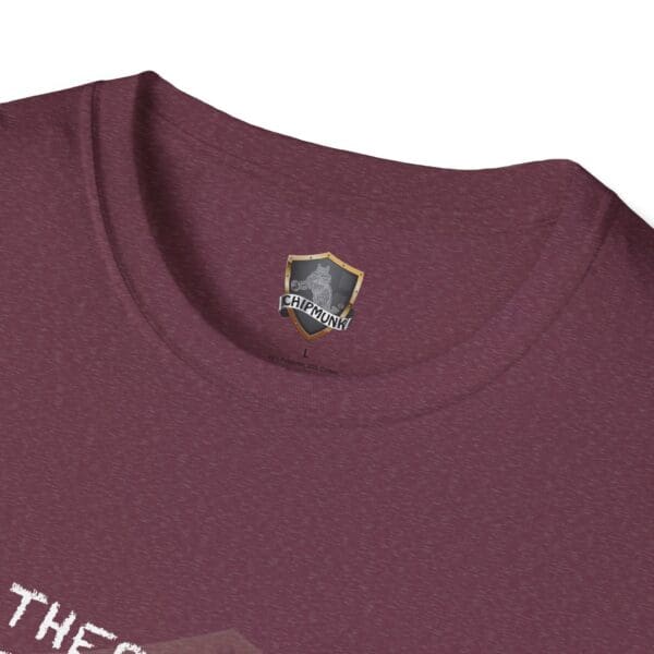 Detailed shot of a maroon "There's a First for Everything... Except Impressions!" T-shirt featuring a discreet Chipmunk logo tag on the inside collar.