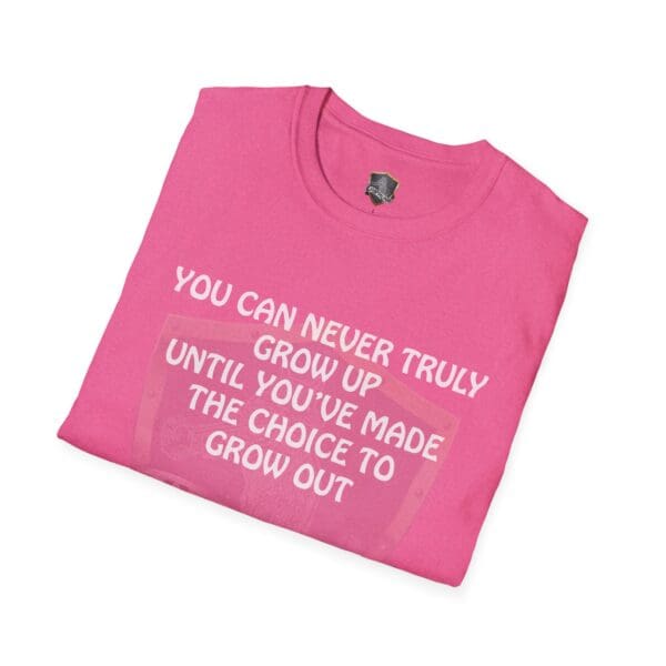 'You Can Never Truly Grow Up' T-shirt in pink, featuring the phrase "You can never truly grow up until you've made the choice to grow out," printed prominently in large white letters.