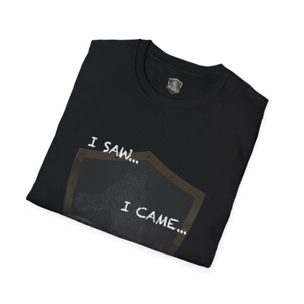 Black folded "I Saw T-Shirt" featuring a design of a trumpet-playing cat with the text "I SAW... I CAME..." on top of a shield graphic.